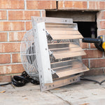 Ventilation fan attached to a brick wall